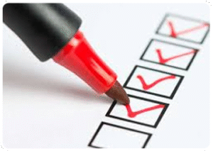 A red marker ticking a compliance checklist for building inspections in the Southern Highlands