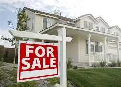Residential house with a 'For Sale' sign, indicating property market and pre-purchase inspection services